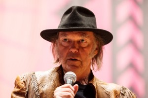 Singer Neil Young speaks during a press conference for the Honour the Treaties tour in Toronto, Sunday January 12, 2014. Photograph by: Mark Blinch , THE CANADIAN PRESS